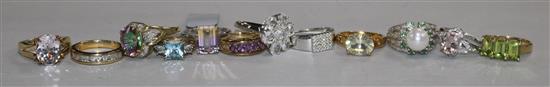 Twelve assorted modern 9ct and gem set dress rings.